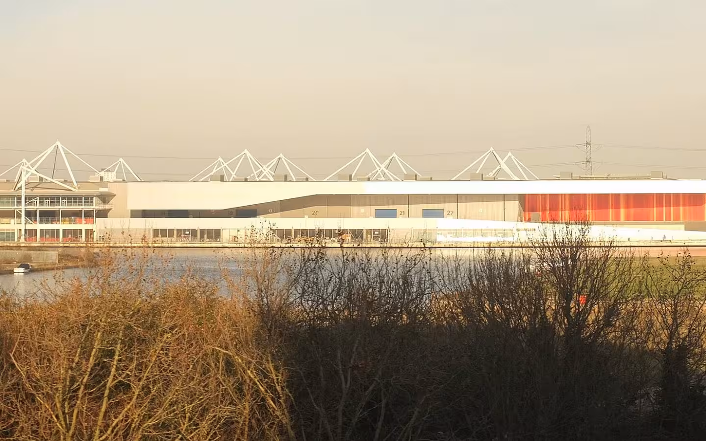 ExCeL Exhibition Centre London, modern building with white roof and waterfront