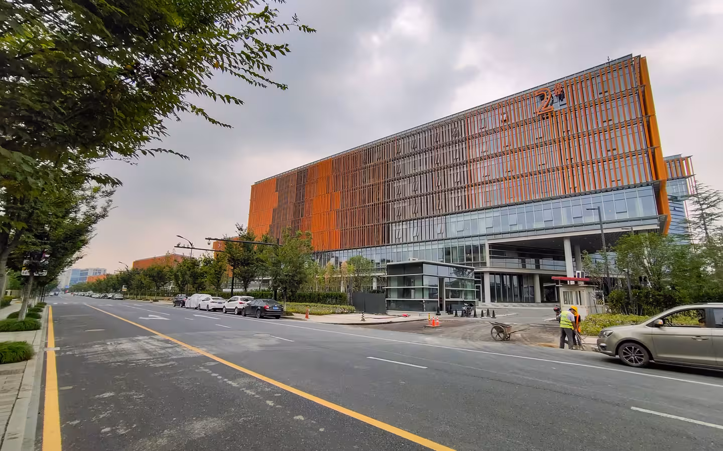 Phase 4 of Alibaba Xixi Park modern orange‑facade building