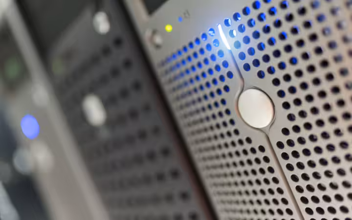 Close-up of a server rack with blue LED lights