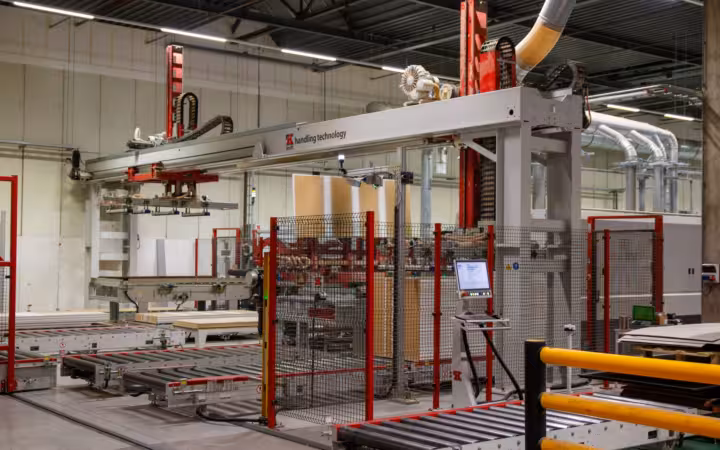 Industrial machinery with robotic arm in a modern manufacturing facility