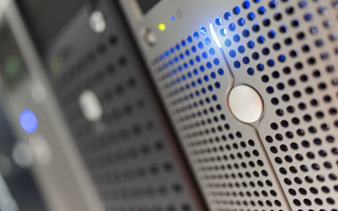 Focused detail of a modern server rack with blue LED indicators.