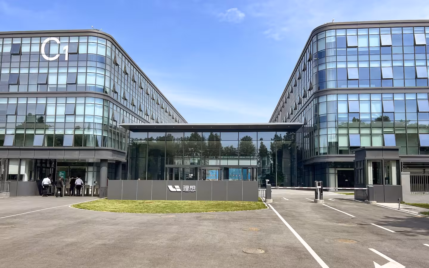 The modern glass facade of the Li Auto R&D Headquarters, Block C