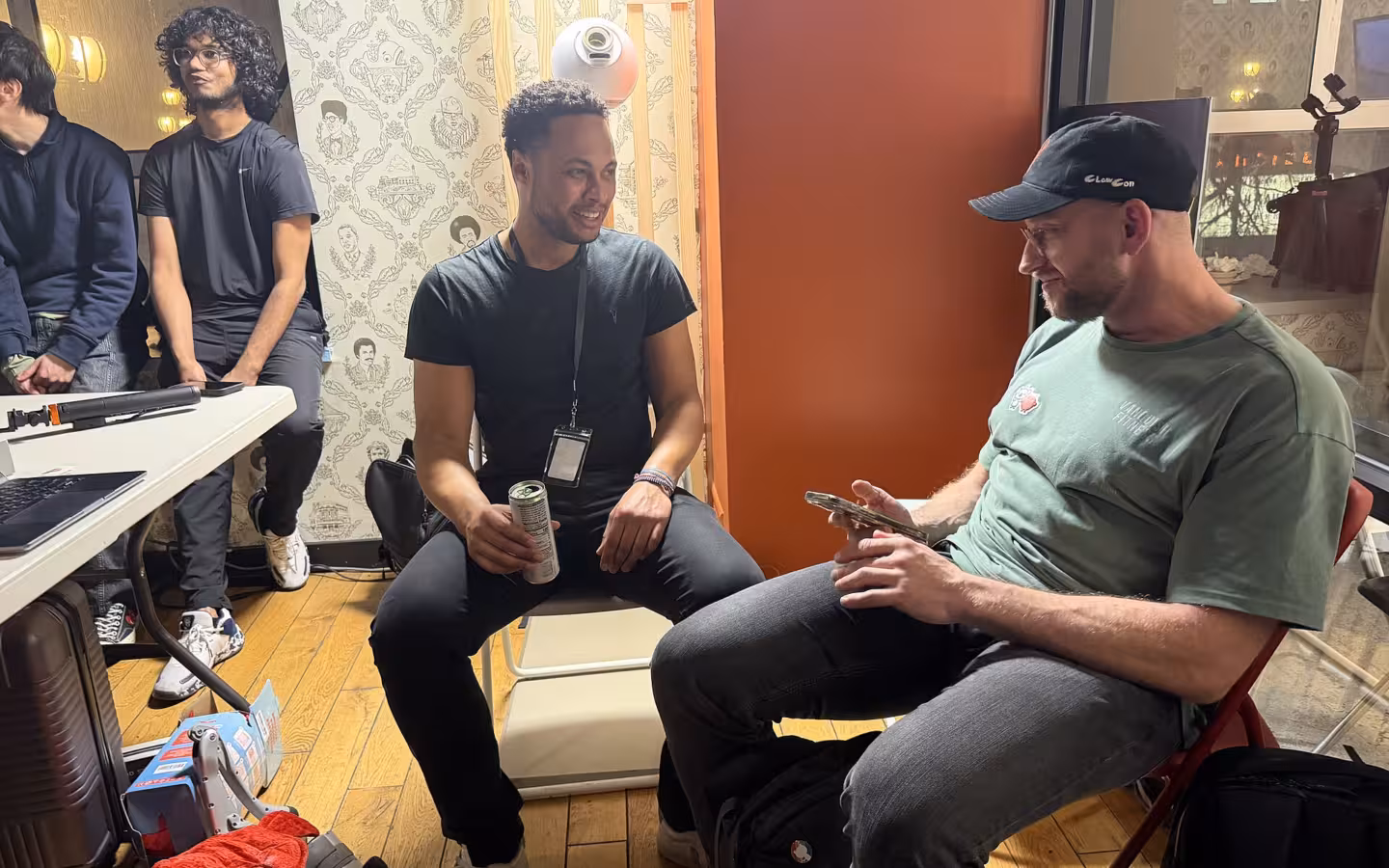 Peter Steinberger and Tomas Taylor sitting and talking together at ClawCon 2026