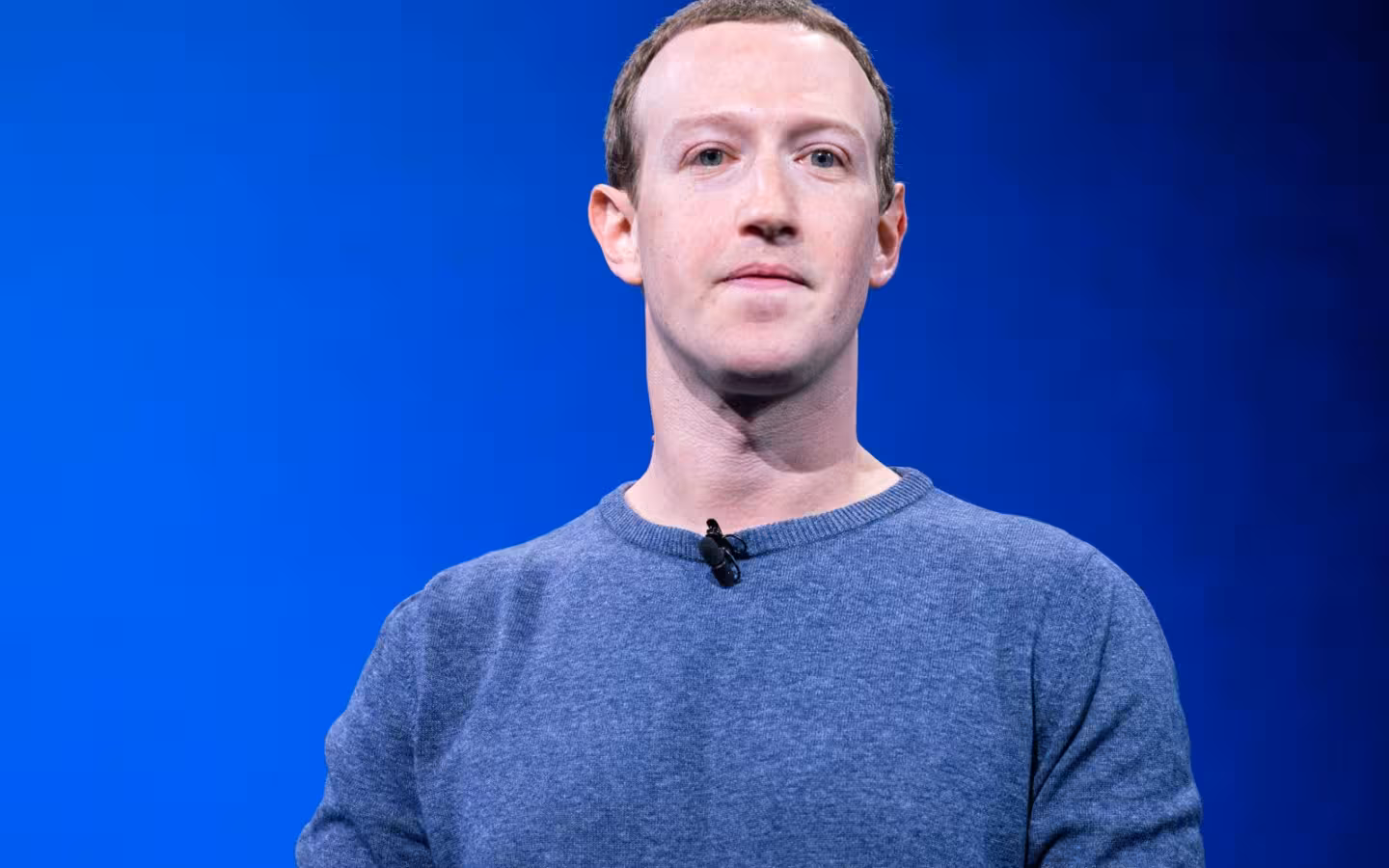 Mark Zuckerberg in a blue background portrait photo