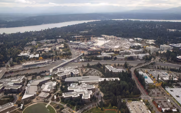 An aerial view of the Microsoft Redmond Campus redevelopment with surrounding landscape.
