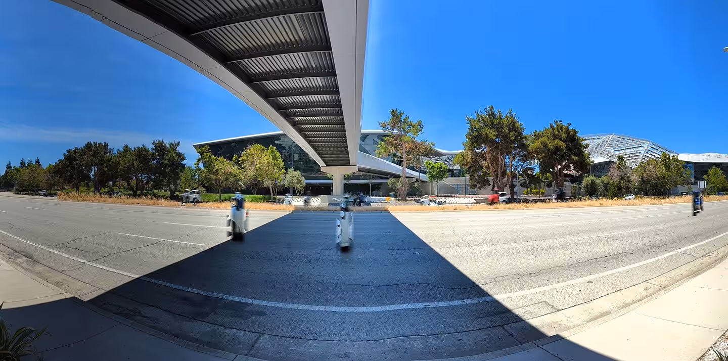 Wide-angle panoramic view of San Tomas Expressway and Nvidia campus with overhead bridge