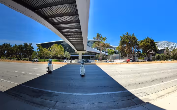 Wide-angle panoramic view of San Tomas Expressway and Nvidia campus with overhead bridge