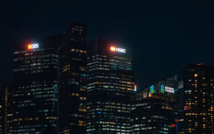 Illuminated skyscrapers of major banks in Singapore financial district at night