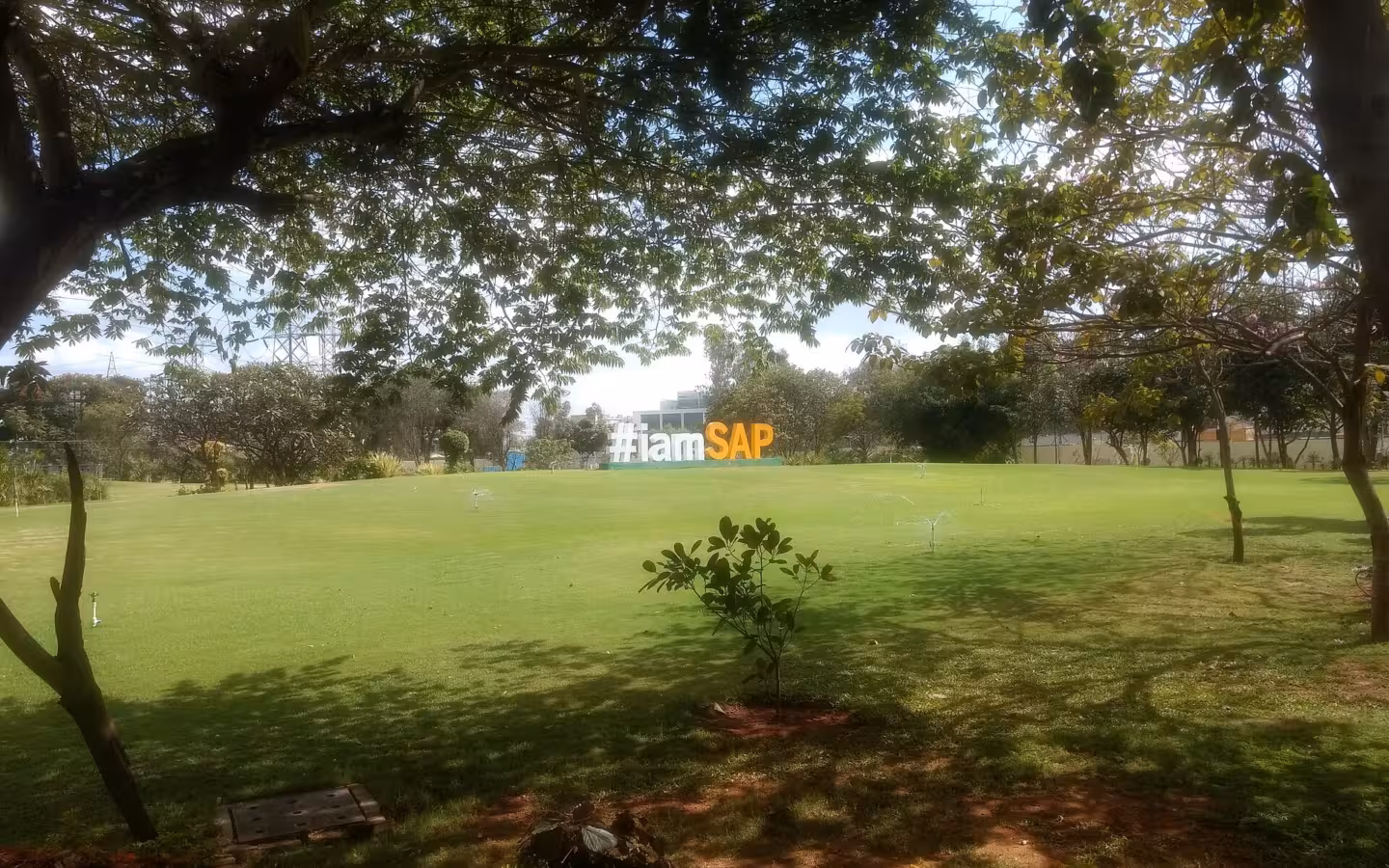 SAP Labs India campus sign on a grassy field