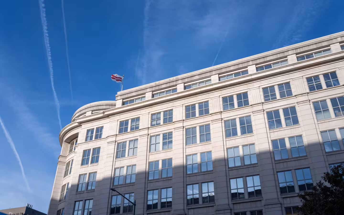 Elegant office building under clear blue sky in Washington D.C.