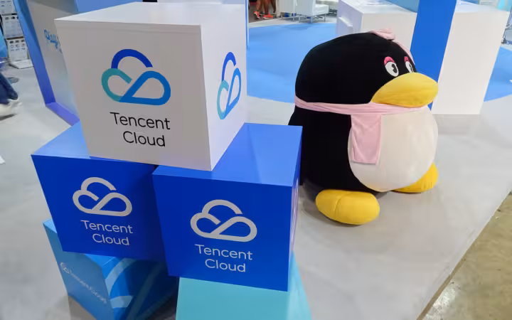 Tencent Cloud display booth at Tokyo Game Show with mascot and branded cubes