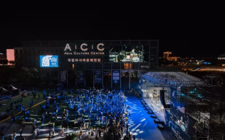 Night concert at Asia Culture Center with crowd outdoors