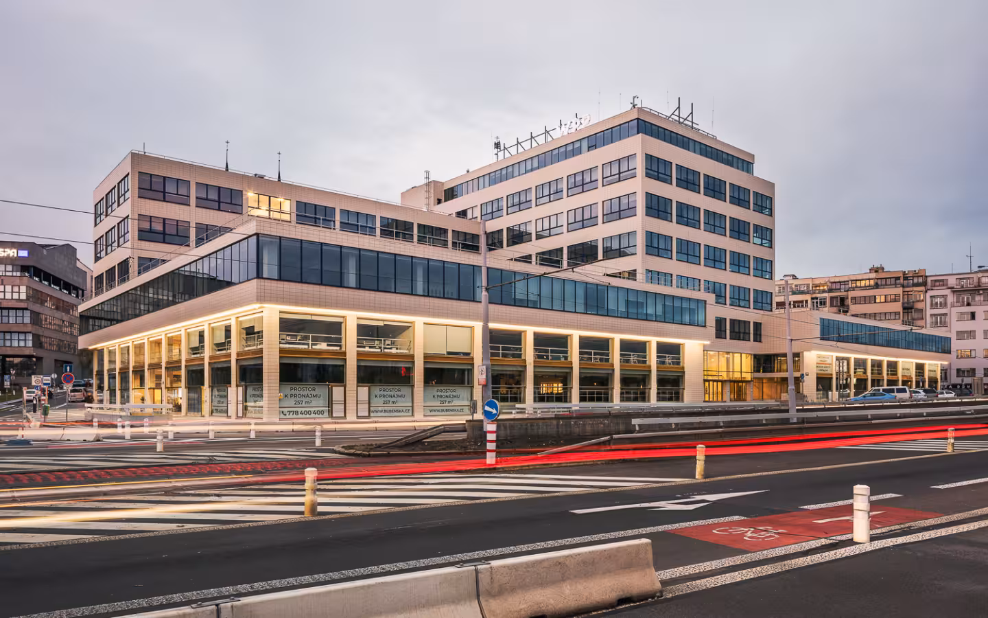 a wide exterior view of a large modern multi-story office building