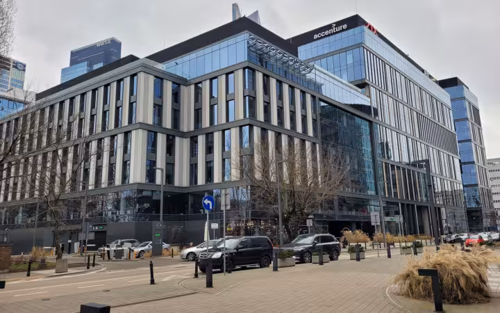 Proximo office building in Warsaw with Accenture signage above the street