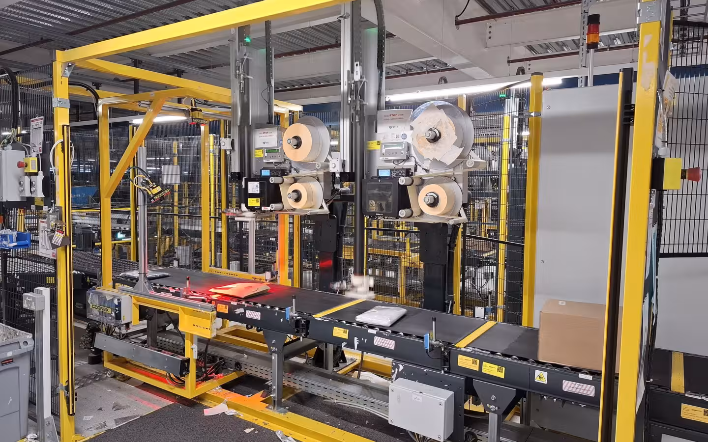 Automated scanning and labelling machinery inside Amazon's Swindon fulfilment centre