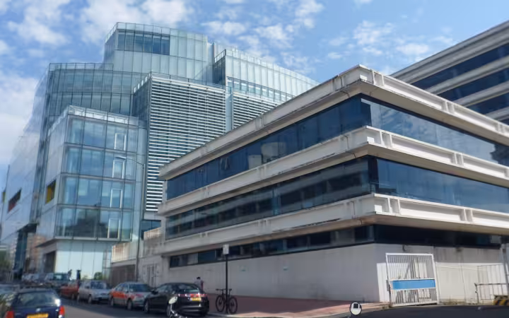 American Express European Service Centre buildings beside parked cars in Brighton