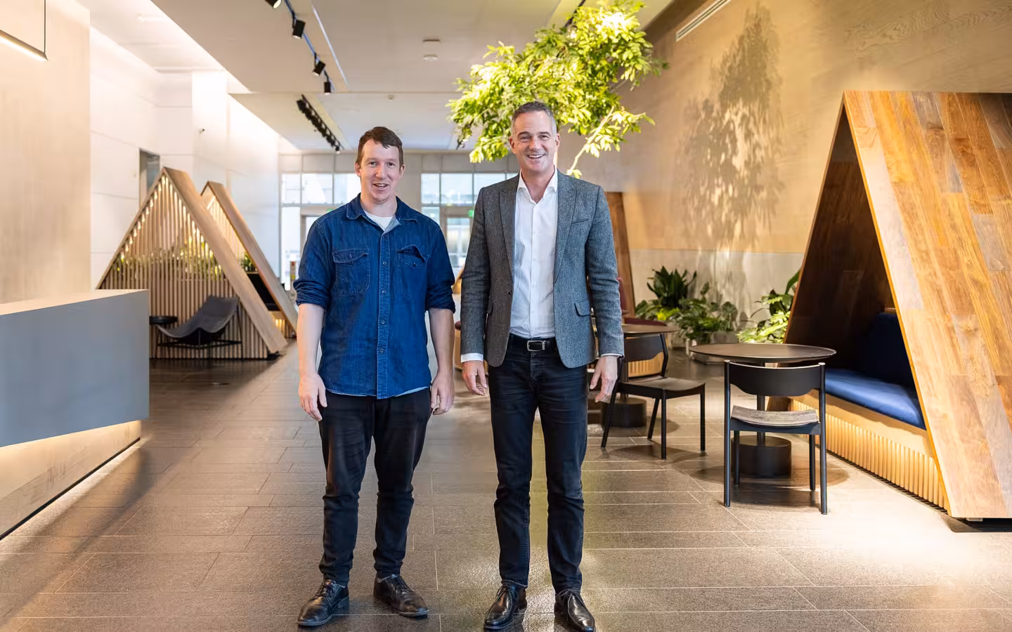 Two men stand in an office during Peter Kyle’s visit to Anthropic.