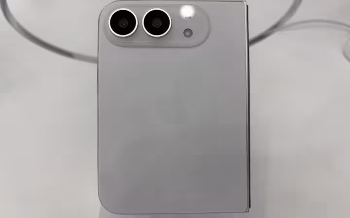 The rear of a white iPhone Duo, with two cameras and an Apple logo.
