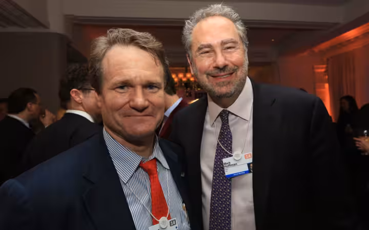 Brian Moynihan and Mark Hoffman pose together at a Davos reception.