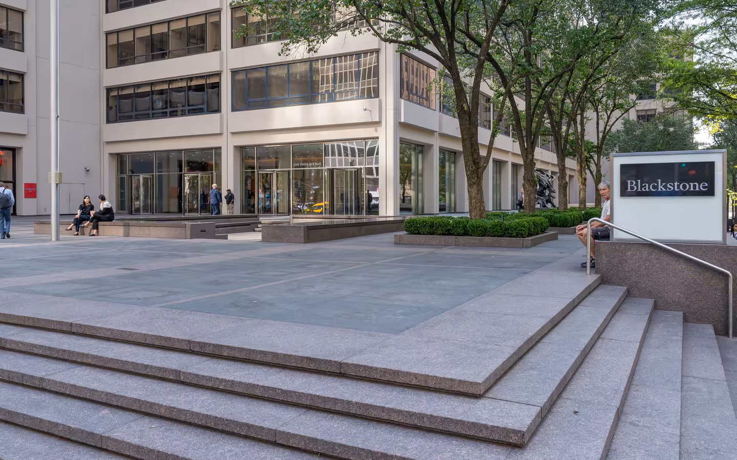 Blackstone sign beside the steps and planted forecourt of 345 Park Avenue
