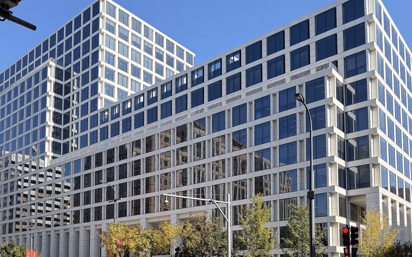 People's Bank of China headquarters rises above a busy Beijing street