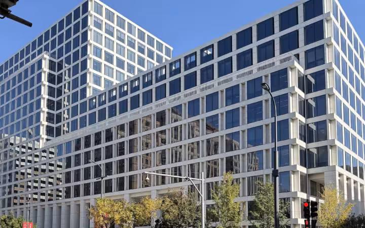 People's Bank of China headquarters rises above a busy Beijing street