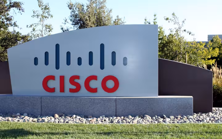 Cisco sign at its San Jose main campus, surrounded by trees and grass