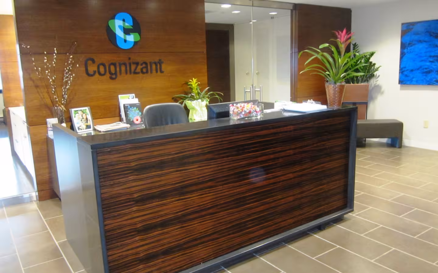 Cognizant’s Teaneck office reception, with its logo above a large desk