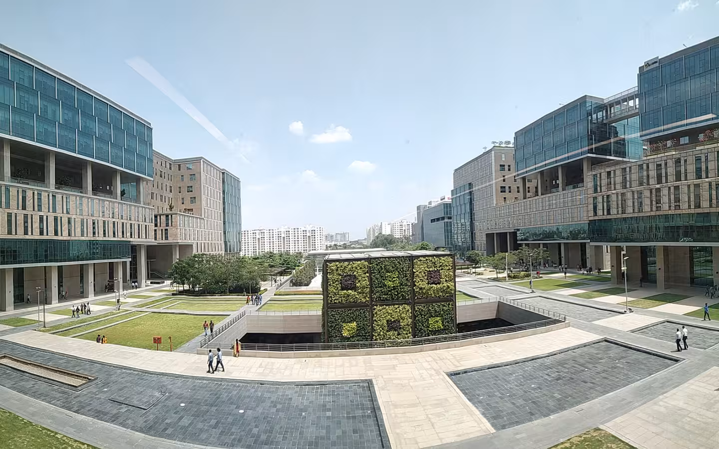 RMZ Ecoworld office buildings surrounding a landscaped courtyard in Bangalore