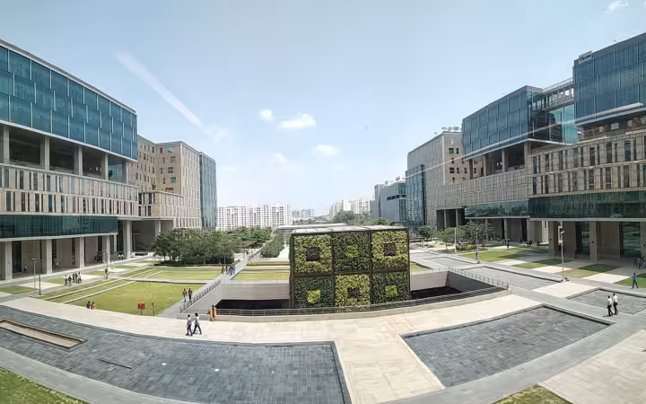 RMZ Ecoworld office buildings surrounding a landscaped courtyard in Bangalore
