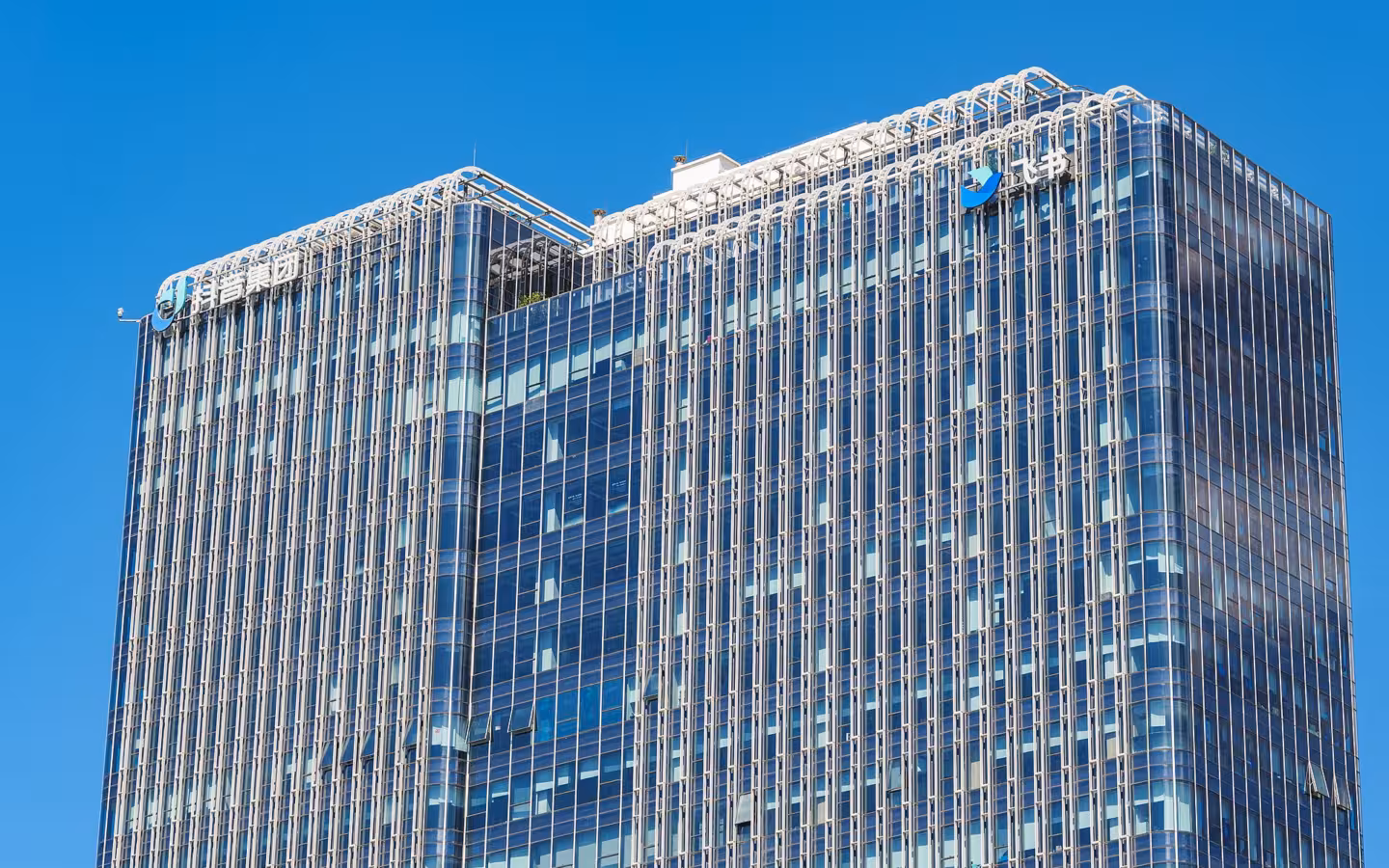 Fashion Vanke Center’s glass towers bearing Douyin Group and Feishu logos.