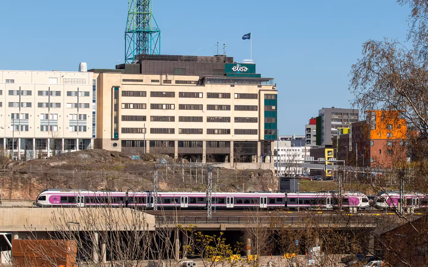 Elisa headquarters building with a train on tracks