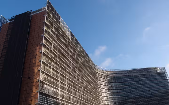 The European Commission’s Berlaymont building beneath a clear Brussels sky
