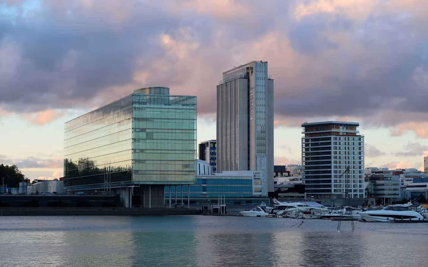 Waterfront buildings in Keilaniemi, Espoo, with Finago Tower and moored boats