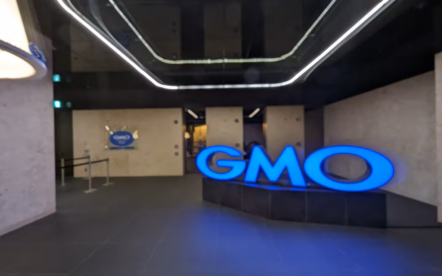 GMO entrance in Fukuras, with a large illuminated logo inside