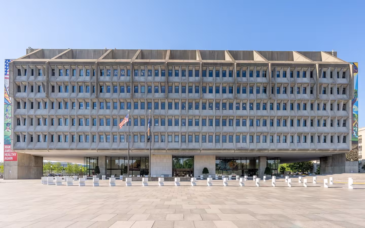 The Hubert H. Humphrey Building across a broad plaza under blue sky
