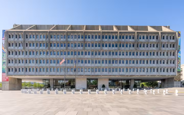 The Hubert H. Humphrey Building across a broad plaza under blue sky
