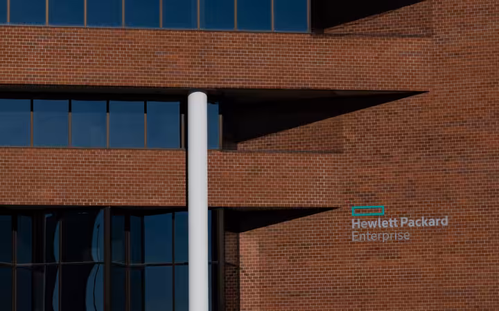 Hewlett Packard Enterprise office building in Omaha, with its logo on a brick wall