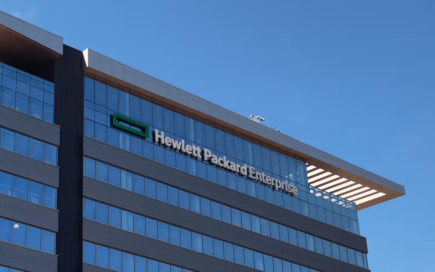 Hewlett Packard Enterprise signage on a glass office building in Bloomington, Minnesota