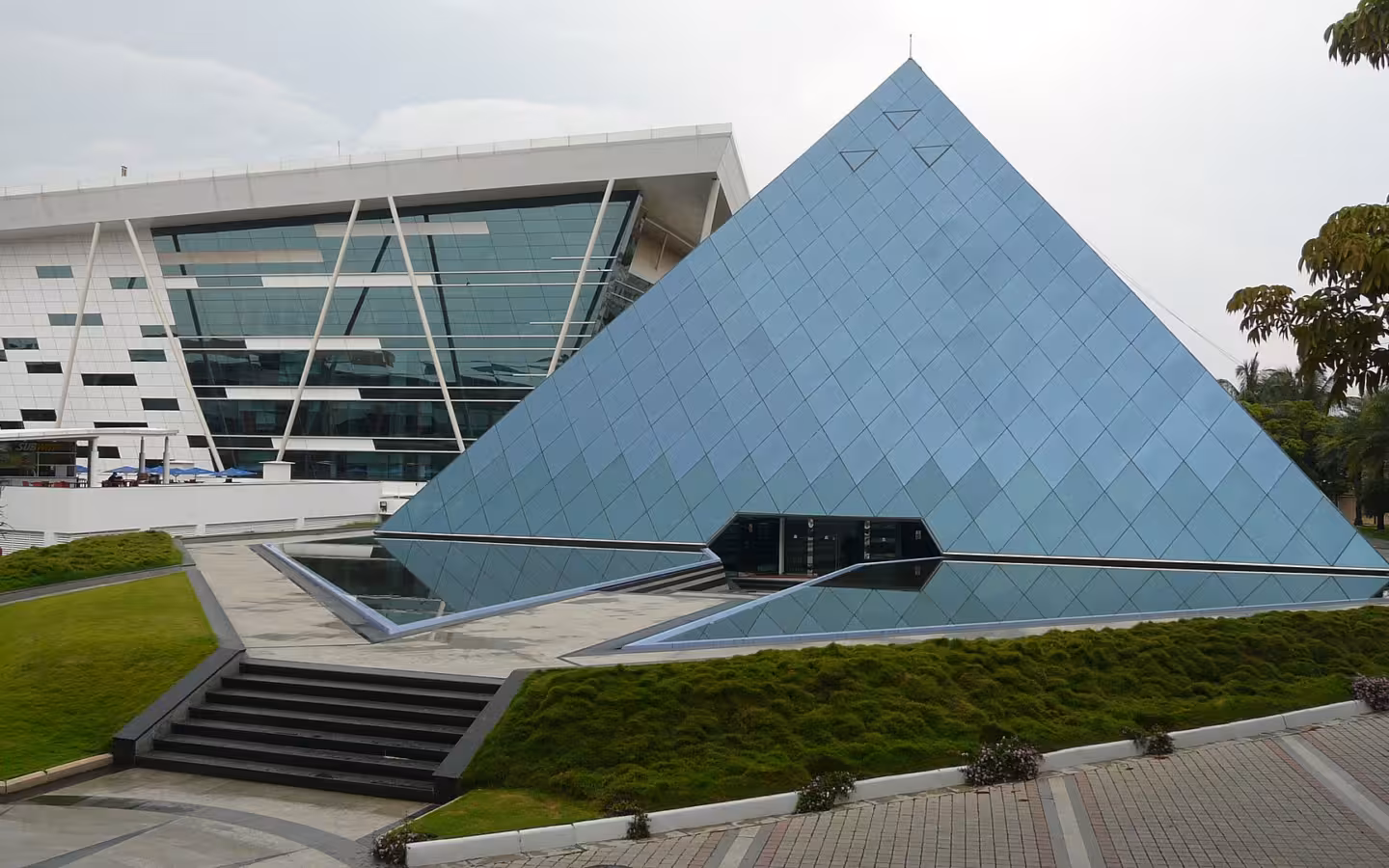 Infosys Bangalore pyramid and adjoining glass office building behind landscaped steps