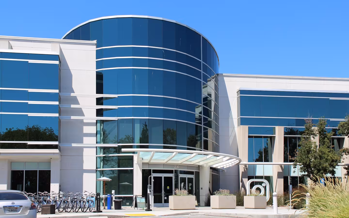Instagram's Menlo Park headquarters, a glass-fronted office building with bicycles outside