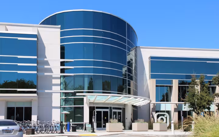 Instagram's Menlo Park headquarters, a glass-fronted office building with bicycles outside