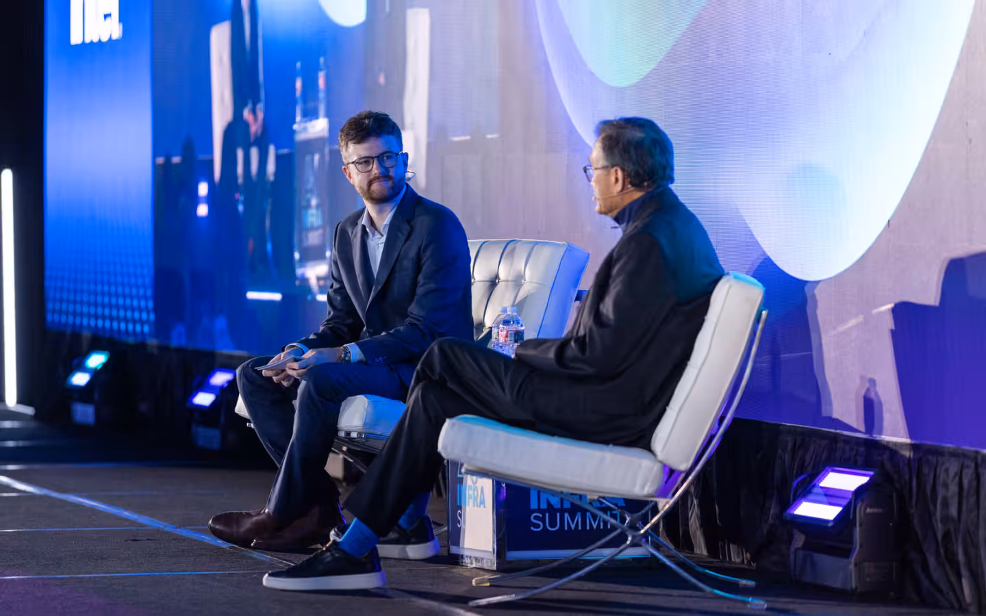 Lip-Bu Tan and Ed Nelson seated in conversation onstage at AI Infra Summit