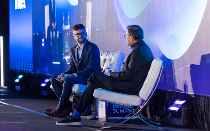 Lip-Bu Tan and Ed Nelson seated in conversation onstage at AI Infra Summit