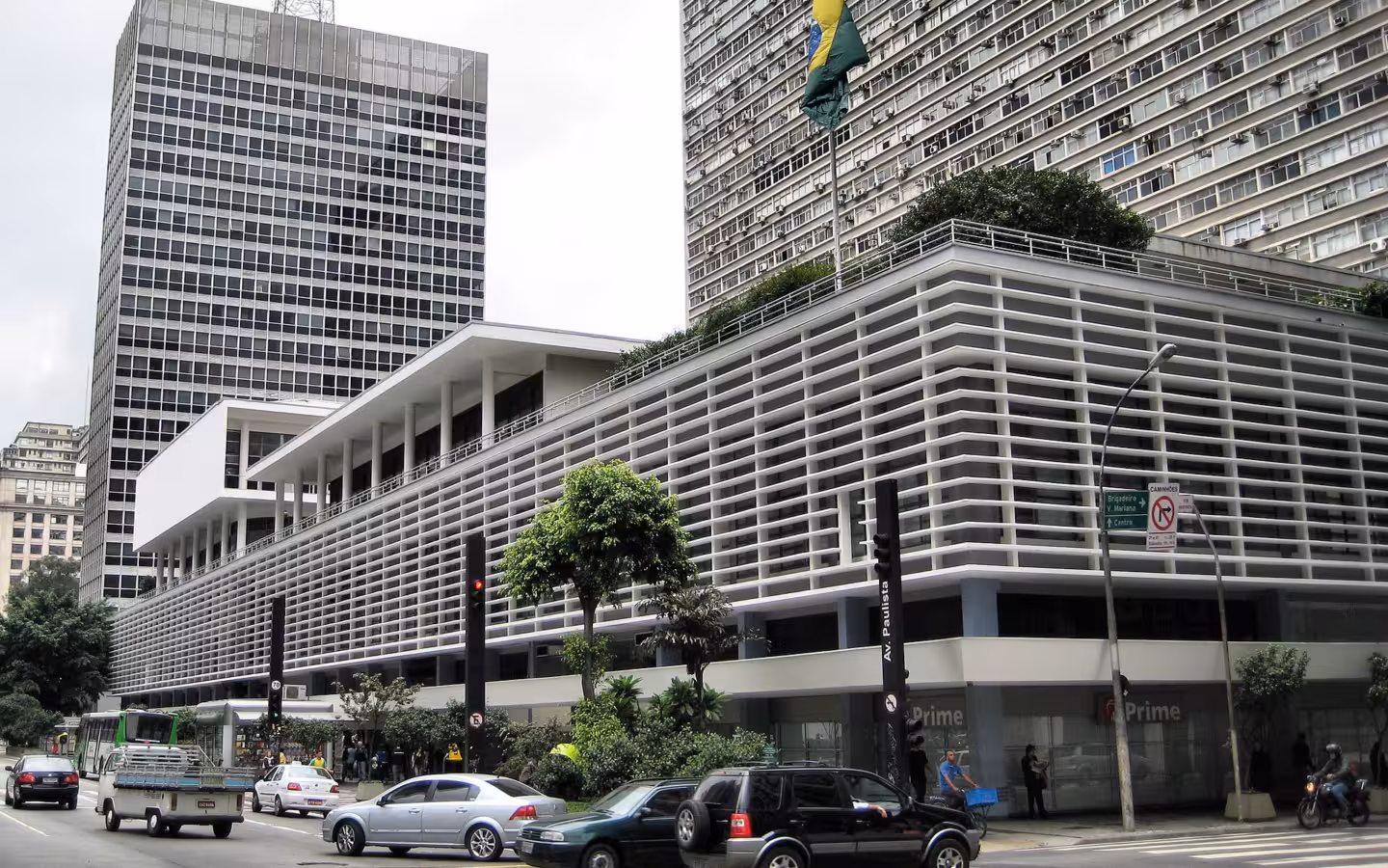 Banco Itau on Avenida Paulista, with traffic and tall buildings around it
