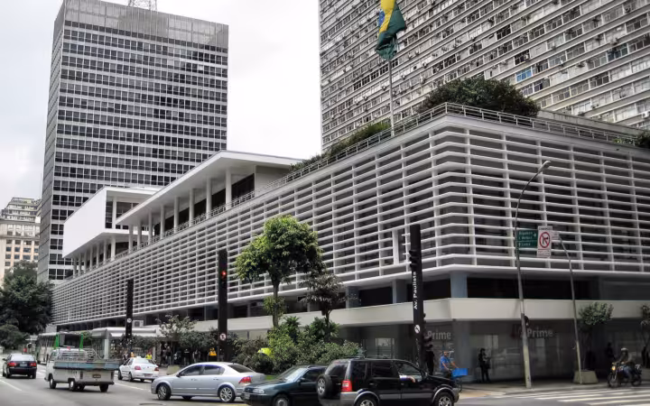 Banco Itau on Avenida Paulista, with traffic and tall buildings around it