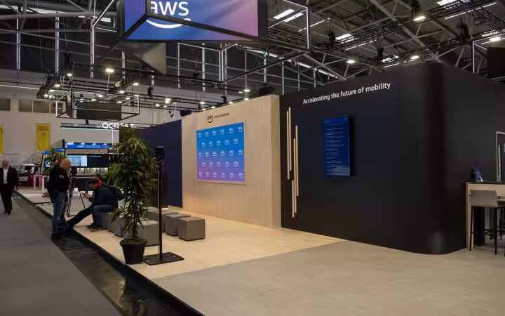 An AWS-branded exhibition booth at the IAA Summit 2025 in Munich.