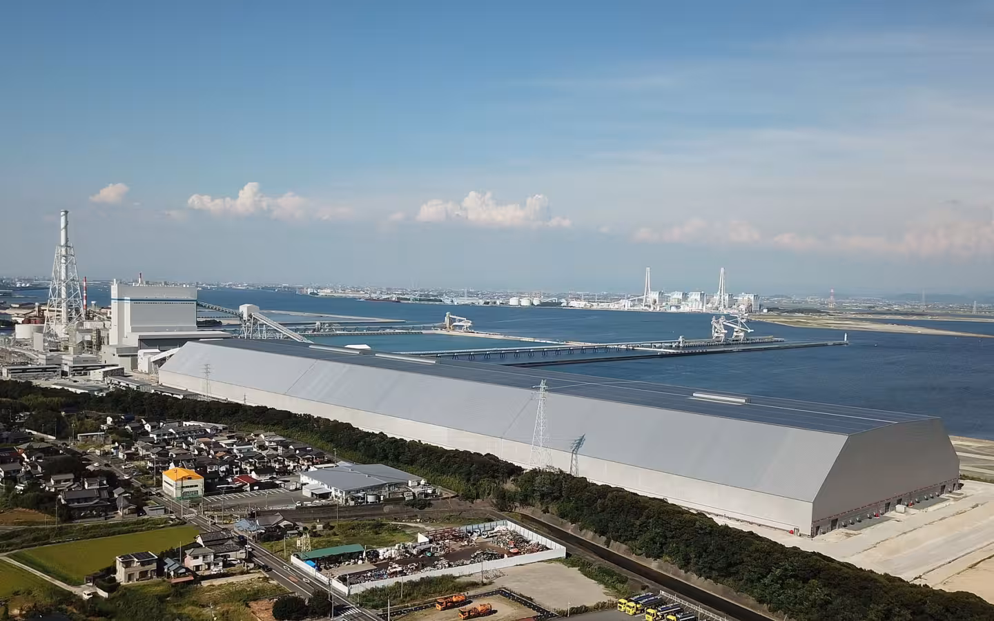 JERA’s Taketoyo thermal power plant beside water and nearby homes