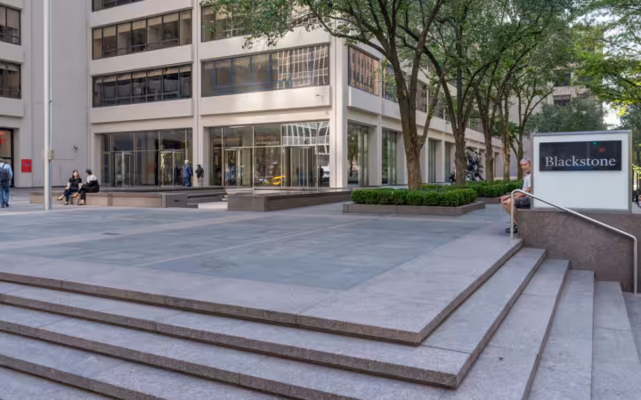 Blackstone sign beside steps, trees and the 345 Park Avenue office entrance