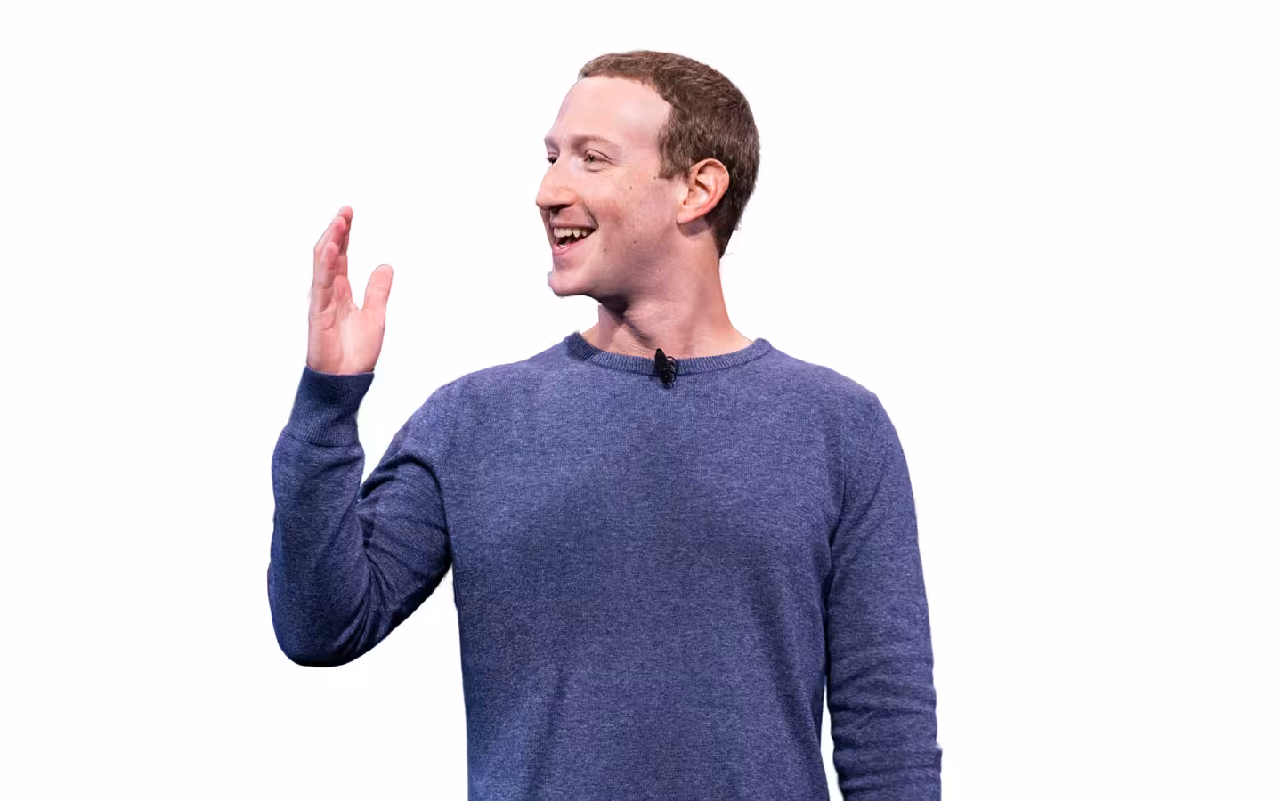 Mark Zuckerberg speaks with one hand raised against a plain white backdrop.